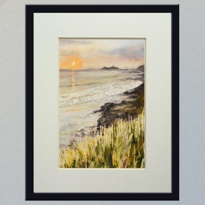 Illustration: Godrevy beach sunset, set inside a dark frame and cream mount