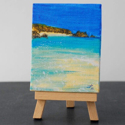 Small painting of low tide at Logan Rock, sat on its own easel